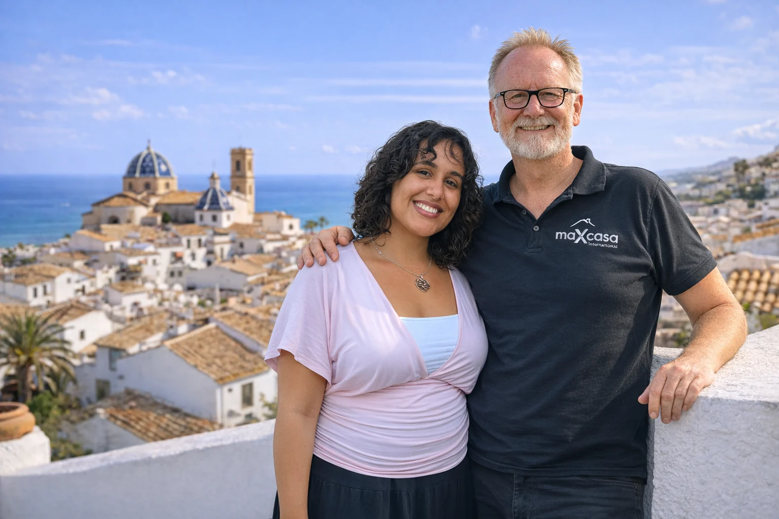 Max and Erica, from maXcasa International, on a terrace overlooking Altea